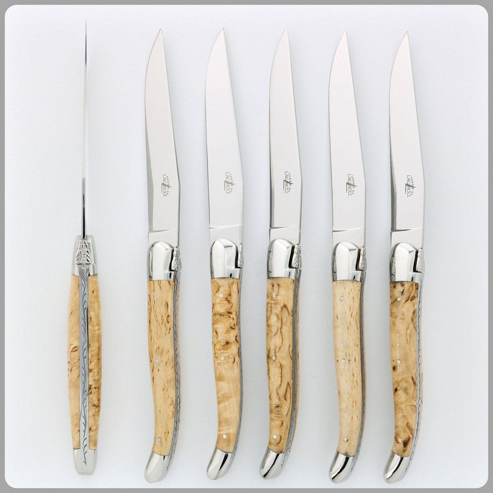 https://www.forge-de-laguiole-usa.com/cdn/shop/files/Forge-de-Laguiole-6-Piece-Steak-Knife-Set-Birchwood-Handle-Shiny-Finish-4.jpg?v=1694251011